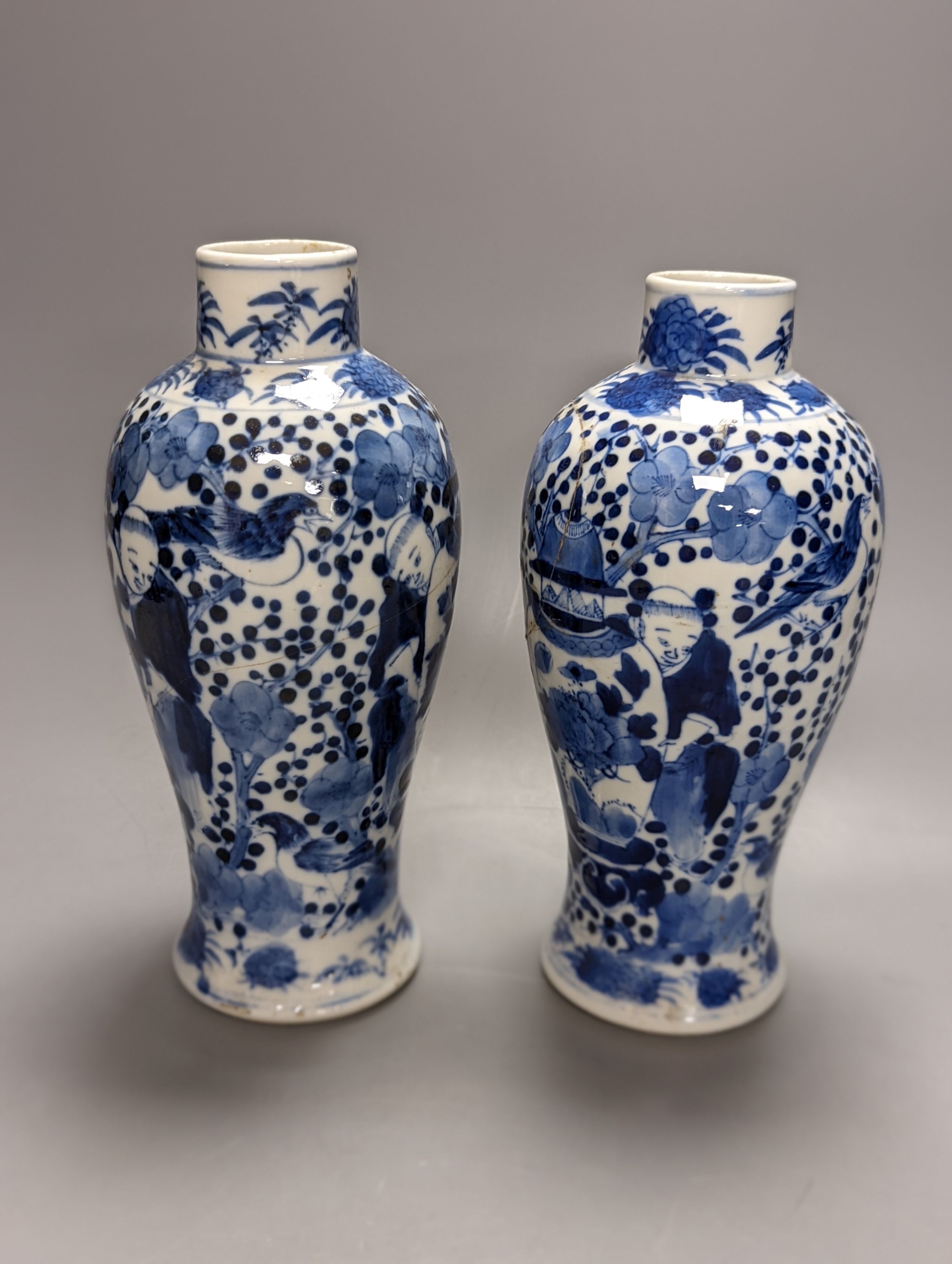 A pair of 19th century Chinese blue and white vases, a prunus vase and cover and a similar jar (4), pair of vases 24 cms high.